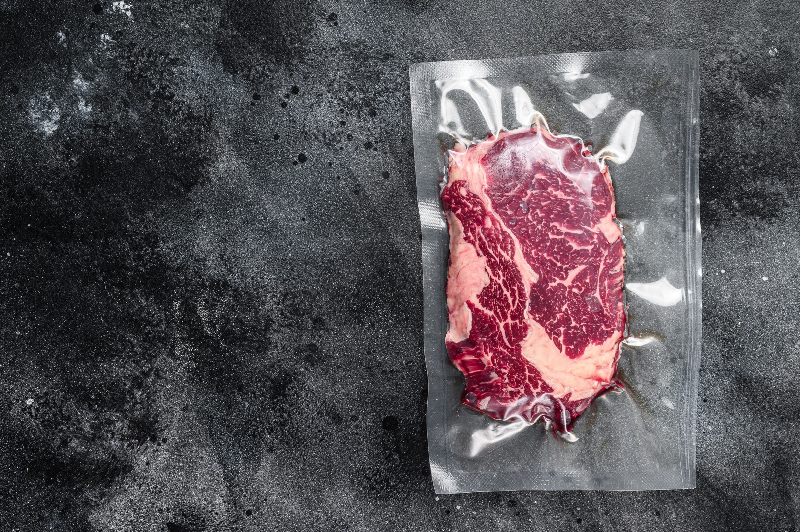 Raw Rib Eye Beef Meat Steak In Vacuum Packaging. Black Background 9072 X 6036 Px